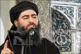  ?? MILITANT VIDEO VIA AP 2014 ?? Islamic State leader Abu Bakr al-Baghdadi is shown in a still image from a video on a militant website. The reclusive leader’s whereabout­s are unknown but he is believed to be in the Islamic State’s dwindling territory in eastern Syria.