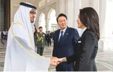  ?? WAM ?? Shaikh Mohammad Bin Zayed greets South Korea’s First Lady Kim Keon-hee in the presence of President Yoon Suk Yeol following their arrival at Qasr Al Watan.