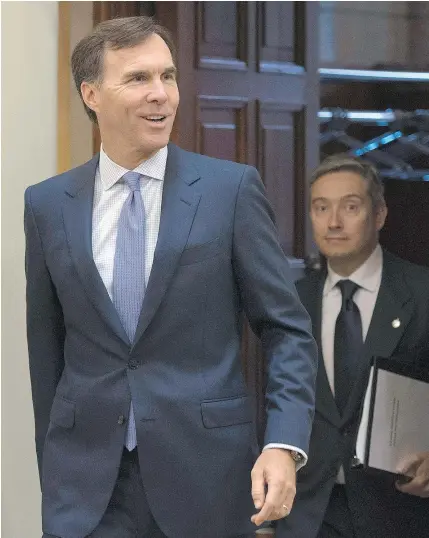  ?? — CP FILES ?? Finance Minister Bill Morneau, left, and Internatio­nal Trade Minister Francois-Philippe Champagne dined at the Diaoyutai State Guest House, an ‘honour reserved for few guests.’
