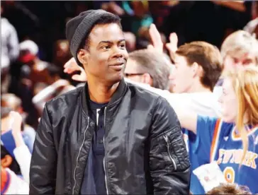  ?? JESSE D GARRABRANT/NBAE/GETTY IMAGES/AFP ?? Comedian Chris Rock attends the game between the New York Knicks and the Atlanta Hawks on January 16 at Madison Square Garden in New York.