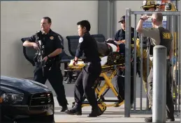  ?? DAVID CRANE — SOUTHERN CALIFORNIA NEWS GROUP ?? A victim is removed from Saugus High School in Santa Clarita after a shooting occurred at the school on Thursday.