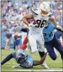  ?? Robert Gauthier / TNS ?? Los Angeles Chargers tight end Hunter Henry (86) runs past Tennessee Titans defenders on Oct.
20, 2019, at Nissan Stadium in Nashville, Tenn. Henry has signed a
3-year, $37.5 million deal with the Patriots, according to a source.