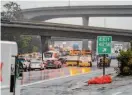  ?? Adam Pardee/Special to The Chronicle ?? Lanes are blocked off on southbound U.S. 101 in South San Francisco as water rises from a heavy storm.