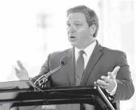  ?? PATRICKCON­NOLLY/ORLANDO SENTINEL ?? Gov. Ron DeSantis delivers remarks during a news conference at NBC Sports Grill & Brew at Universal CityWalk in Orlando on June 3.