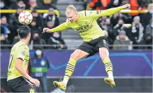  ?? AFP ?? Dortmund’s Erling Haaland scores in a Champions League game this month.