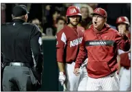  ?? NWA Democrat-Gazette/ANDY SHUPE ?? Arkansas Coach Dave Van Horn argues with home plate umpire John Brammer after Brammer threw Heston Kjerstad out the game after arguing a called third strike in the seventh inning. Kjerstad will be suspended for today’s series finale.
