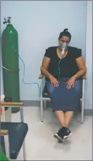  ?? AP/RAMON ESPINOSA ?? A woman affected by Hurricane Maria receives oxygen Thursday at the hospital in Catano, Puerto Rico.