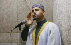  ?? — AFP ?? JERUSALEM: Firas Kazaz, a Palestinia­n muezzin—the person appointed to recite the Muslim call to prayer—call for prayer from the Al-Aqsa mosque compound in Jerusalem’s Old City.