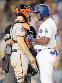  ??  ?? OUTFIELDER YASIEL PUIG reacts to San Francisco catcher Nick Hundley on Tuesday and gets ejected from a close game.