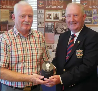  ??  ?? Ray Campbell, overall winner of the County Louth Golf Club Captain’s Prize, is congratula­ted by Captain Harry Collier.