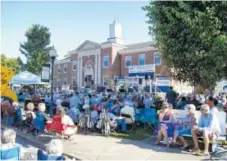  ?? PHOTOS FROM 1890SDAYS. COM ?? A crowd listens to a band play at the courthouse stage during a prior 1890’s Day Jaboree.