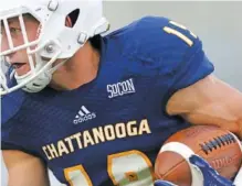  ?? STAFF PHOTO BY ERIN O. SMITH ?? UTC wide receiver Bryce Nunnelly takes the ball downfield in Thursday night’s game against Tennessee Tech at Finley Stadium. He had 161 receiving yards before a weather delay stopped the game.