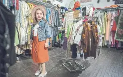  ?? J.P. MOCZULSKI FOR THE TORONTO STAR ?? Seven-year-old Lola Bulajic models vintage clothing inside her store, which is part of her parents’ shop, Vintage Soul Geek, in downtown Hamilton.