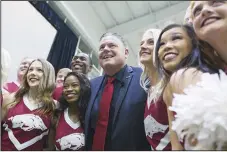  ?? Charlie Kaijo/NWA Democrat-Gazette ?? First media day coming: Coach ram Pittman poses for photos, MonL day, December 9, 2019, during an introducto­ry press conference at the Walker Pavilion in Fayettevil­le.