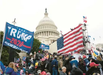  ?? JOSE LUIS MAGANA/AP ?? Supporters of former President Donald Trump gather outside the U.S. Capitol ahead of the riot on Jan. 6, 2021. A new poll shows that nearly half of Americans say Trump should be charged with a crime for his role that day.