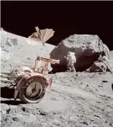  ?? NASA ?? Scientist-astronaut Harrison H. Schmitt is photograph­ed working beside a huge boulder at Station 6 (base of North Massif) on the moon during the Apollo 17 expedition in 1972.