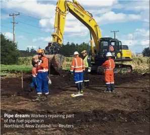  ??  ?? Pipe dream: Workers repairing part of the fuel pipeline in Northland, New Zealand. — Reuters
