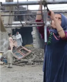  ?? EPA ?? People salvage their belongings after heavy rains in MomandDara district of Nangarhar province, Afghanista­n