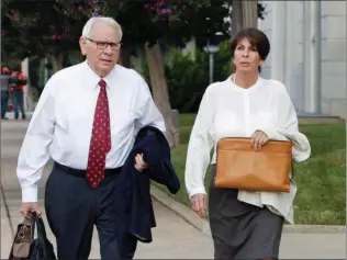  ?? Associated Press ?? Former Arkansas Treasurer Martha Shoffner, right, and her attorney Chuck Banks walk to federal court on Friday in Little Rock for Shoffner's sentencing on multiple counts of extortion and bribery.