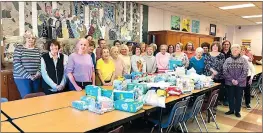  ?? Photo submitted ?? C D of A members are shown with their donations they presented to Theresia Kear, pictured far right, from the Maternity Closet.