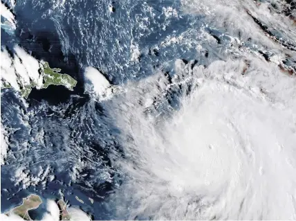  ??  ?? > The eye of Hurricane Maria as it neared Dominica with 160mph winds