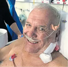  ??  ?? British expat Mike Hodge cracks a smile as he recovers in hospital