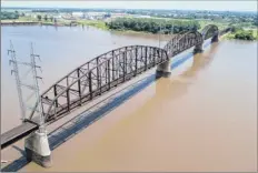  ?? Jeff Roberson / Associated Press ?? The Merchants Bridge in St. Louis is in danger of being shut down if it is not replaced soon, but officials are uncertain how to pay for the fix and the 12,500 tons of steel it would require.