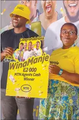  ?? ?? Yenzi a Mobile Money agent walked away with E2 000 as a cash prize for being the best vendor.