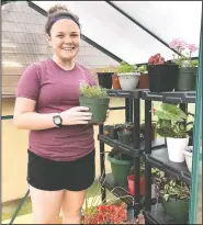  ?? (Courtesy Photo) ?? MacKenzie Sontag, a freshman at Siloam Springs High School, is continuing to study plants in her greenhouse at home. The time she spends working in her greenhouse at home will count toward her supervised agricultur­e experience for ag classes at school.