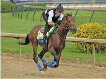  ?? AP PHOTO/CHARLIE RIEDEL ?? Kentucky Derby entrant Game Winner is ridden during a workout Wednesday at Churchill Downs on Wednesday in Louisville, Ky. Game Winner is now the 9-2 favorite to win Saturday’s race with Omaha Beach out because of a breathing problem.