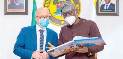  ??  ?? Ambassador of Finland to Nigeria, Dr. Jyrki Pulkkinen (left) being presented with a souvenir by the Lagos State Governor, Mr. Babajide Sanwo-Olu during a courtesy visit to the Governor, at Lagos House, Marina yesterday