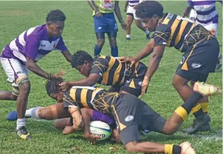  ?? Photo: Waisea Nasokia ?? Malolo’s Titilia Lawakeli is tackled by her opposite number from Vatukoula in the Royal Tea Ranadi Cup quarterfin­al at Lawaqa Park, Sigatoka, June 24, 2022.