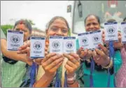  ?? PTI ?? Pilgrims display their RFID tags, after getting themselves registered for the Amarnath Yatra 2022, in Jammu on Friday.