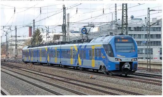  ?? BEN JONES. ?? Stadler has delivered hundreds of FLIRT EMUs to operators in mainland Europe over the past decade. On January 29, six-car set ET309 of Bavarian regional operator Meridian passes Heimeranpl­atz station in Munich, with a Regional Express to Kufstein in...