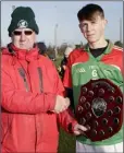  ??  ?? Jim Murphy presents the Top Oil Leinster PP Junior Hurling ‘B’ Shield to Gorey CS captain Eamon Doran.