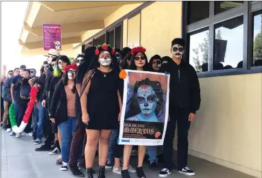  ?? RECORDER PHOTOS BY JUAN AVILA ?? Monache High School students stand at the ready with painted faces and other decor as they get ready to begin a ‘Dia de los Muertos’ procession around campus Friday, Nov. 2.