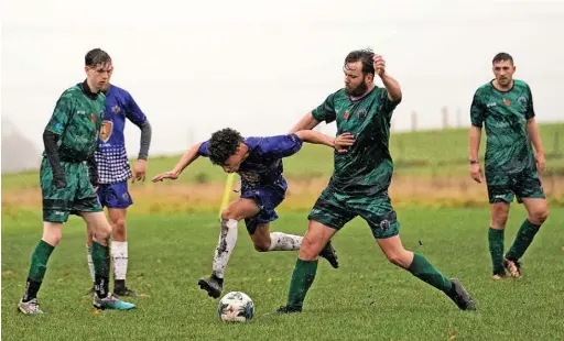  ?? Pics: Peter Shipton ?? ●●Action from Rochdale Mayfield FC’S clash against AFC GTAS, which Mayfield led 2-1 at half time. The weather took its toll on the fixture, however, with the match abandoned on 54 minutes.