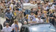  ?? ANDREW RUSH — PITTSBURGH POST-GAZETTE VIA AP ?? Pittsburgh Penguins’ Sidney Crosby hoists the Stanley Cup during the team’s Stanley Cup NHL hockey victory parade on Wednesday in Pittsburgh.