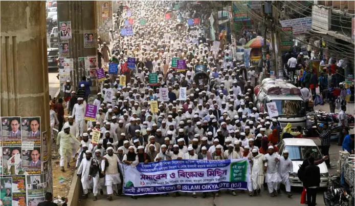  ?? REHMAN ASAD/AGENCE FRANCE-PRESSE ?? MEMBERS of Islamist party ‘Islami Oikyojote’ demonstrat­e demanding the National Curriculum and Textbook Board to scrap changes in the transgende­r inclusive books for schools in Dhaka. Bangladesh’s government defended new school textbooks amid accusation­s they ‘promoted’ gender transition­ing and homosexual­ity.