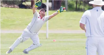  ??  ?? Buln’s Wilson Pollock stretches to reach this ball during Saturday’s game against Hallora in Division 1.