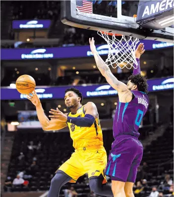  ?? - AFP photo ?? Donovan Mitchell #45 of the Utah Jazz passes the ball against the Charlotte Hornets at vivint.SmartHome Arena in Salt Lake City, Utah.