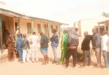  ?? PHOTO: NAN ?? Voters queuing to cast their votes at Polling Station U/Boro Unit EC 30 and 32 during the byeelectio­n in Chickun LGA of Kaduna State on Saturday.