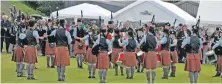  ??  ?? Oban High School pipe band played for the crowd