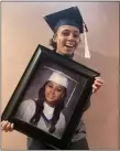  ?? SUBMITTED PHOTO ?? Alasia Petty Lewis of Sharon Hill, shown holding her Academy Park High School graduation photo, graduated from Penn State Brandywine last month with a bachelor’s degree in psychology.