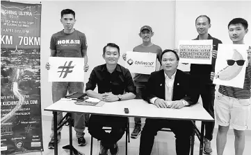  ??  ?? Awang (seated left), Daniel (seated right) and sponsors with the event banner after the press conference. — Photo by Jeffery Mostapa