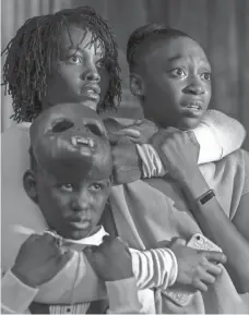  ?? CLAUDETTE BARIUS/UNIVERSAL PICTURES ?? Adelaide (Lupita Nyong’o) protects her children (Evan Alex and Shahadi Wright Joseph) from sinister invaders in “Us.”