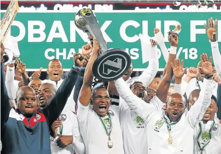 ?? Picture: SHAUN ROY/GALLO IMAGES ?? DAY OF GLORY: Captain Paulus Masehe lifts the trophy after Free State Stars were crowned Nedbank Cup champions at the Cape Town Stadium on Saturday