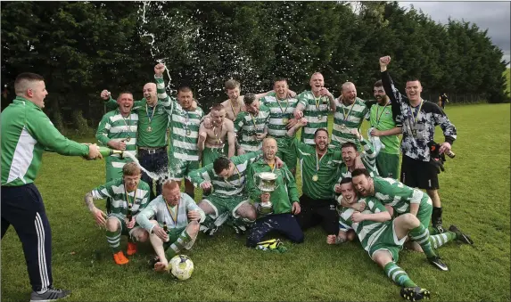  ??  ?? Arklow Celtic celebrate winning the Thomas Scott Cup against Avonmore in Pat O’Toole Park last Saturday. Photos: Garry O’Neill