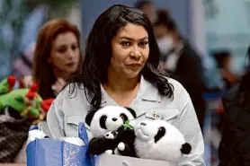  ?? Carlos Avila Gonzalez/The Chronicle ?? S.F. Mayor London Breed wheels a luggage cart with several panda dolls before speaking last Sunday about her trip to China.