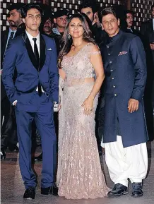  ?? SUJIT JAISWAL AFP ?? INDIAN Bollywood actor Shah Rukh Khan, right, poses for a picture with his wife, Gauri Khan, and son, Aryan Khan. |